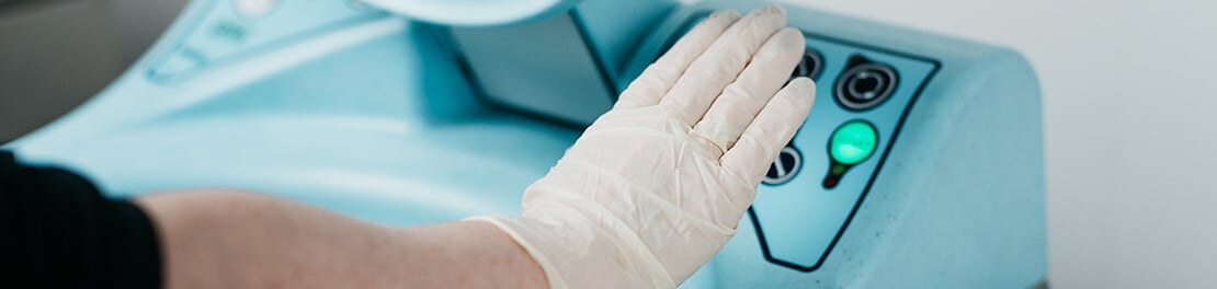 Bedpan washer hands-free opening in action