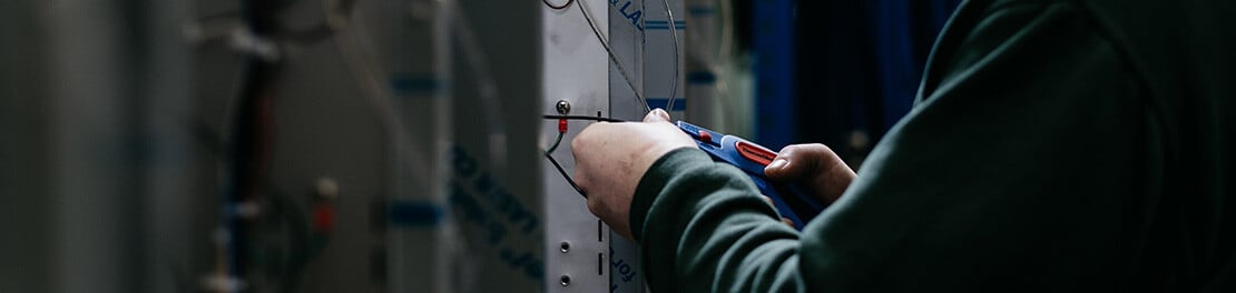 DDC Dolphin engineer working on machine