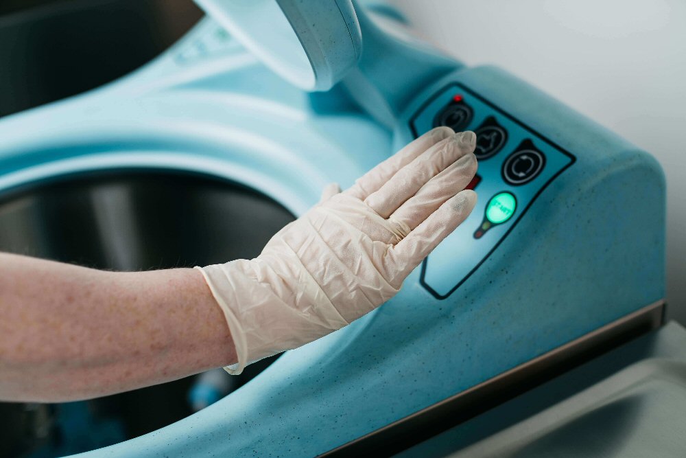 DDC Dolphin Midi Bedpan Washer hands-free in use